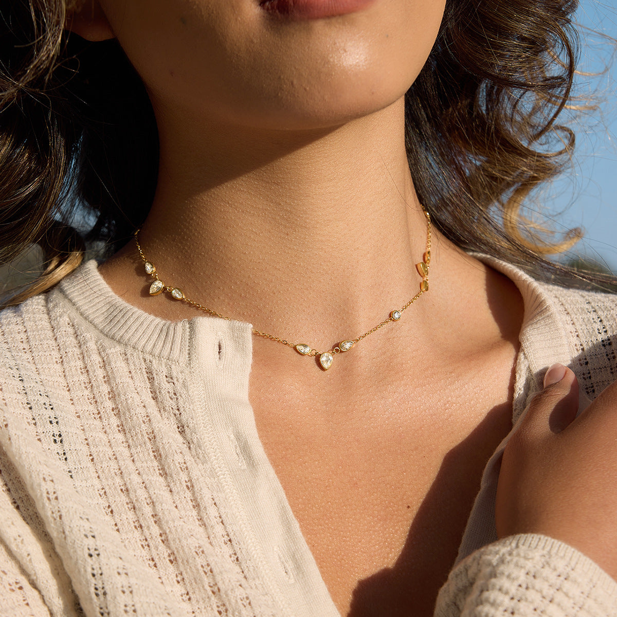 mixed-cut clear-stone station necklace worn on model