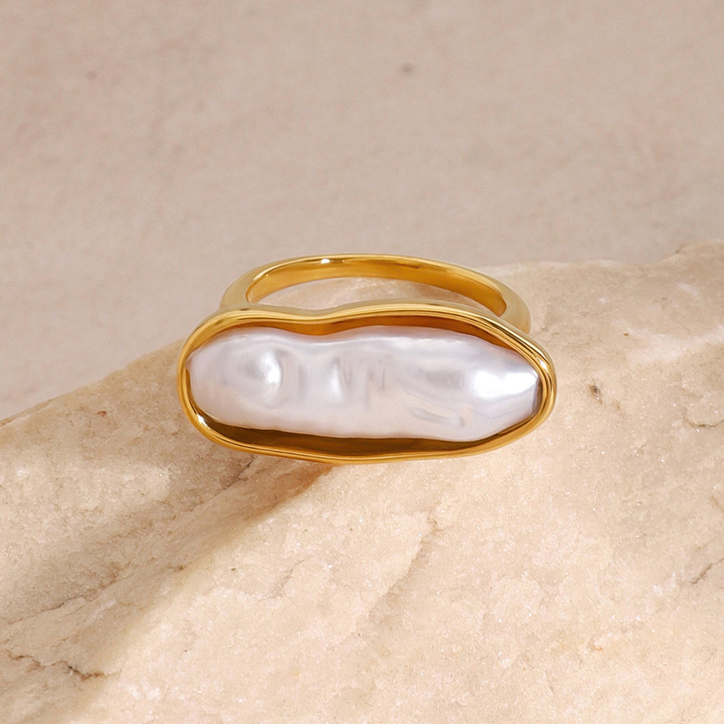 White inlay stainless steel ring shown on a neutral surface