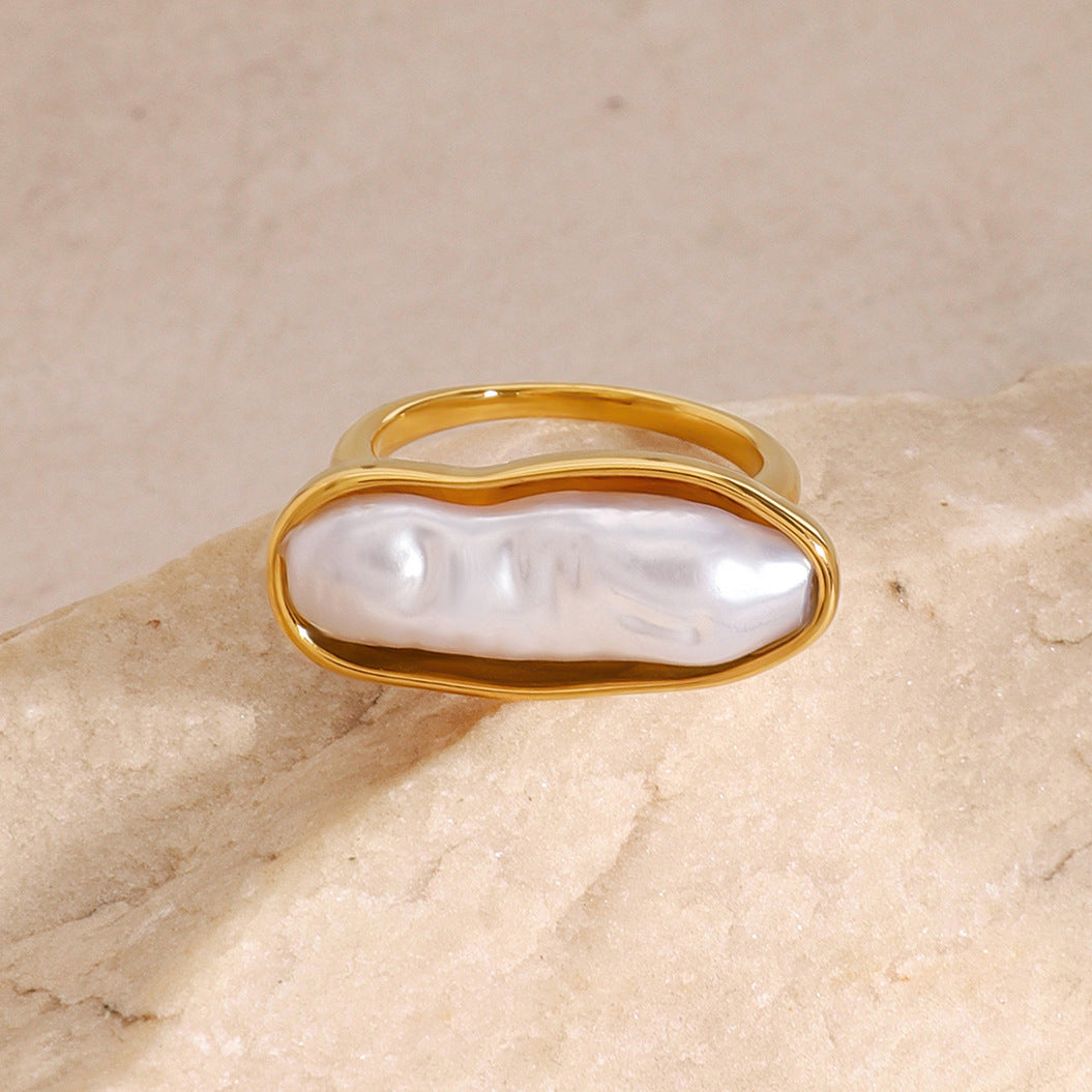 White inlay stainless steel ring shown on a neutral surface