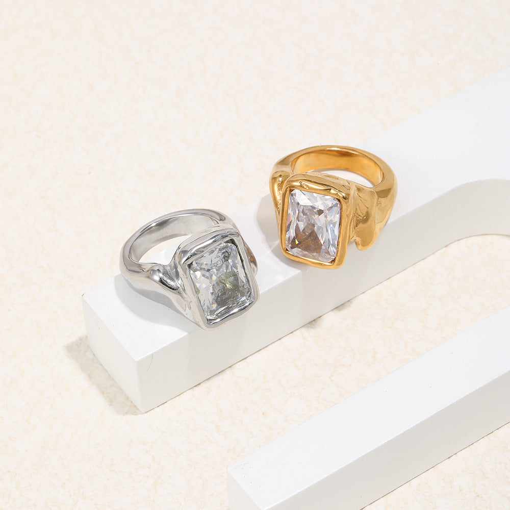 angled pair of rectangular clear-stone signet rings in two finishes
