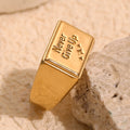 gold plated Never Give Up message signet ring on stone