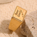 gold plated Never Give Up message signet ring on stone
