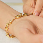 close-up of open geometric bracelet links and wrapped knot connectors