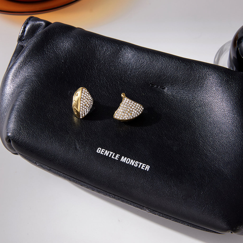 Fan earrings displayed on a black case