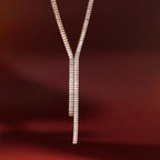asymmetric double-drop clear-stone necklace in warm light