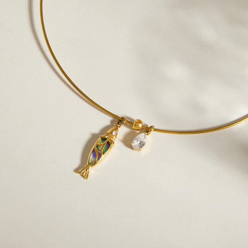 Multicolor fish inlay and pear-shaped clear drop detail