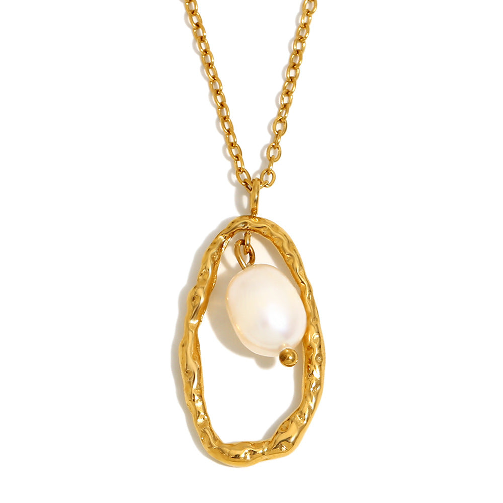 isolated hammered oval necklace with hanging white pearl-style bead