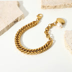Gold-tone Cuban bracelet with freshwater pearl and shell charm