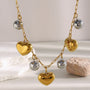 two-tone puffy heart and silver-finish bead charm necklace