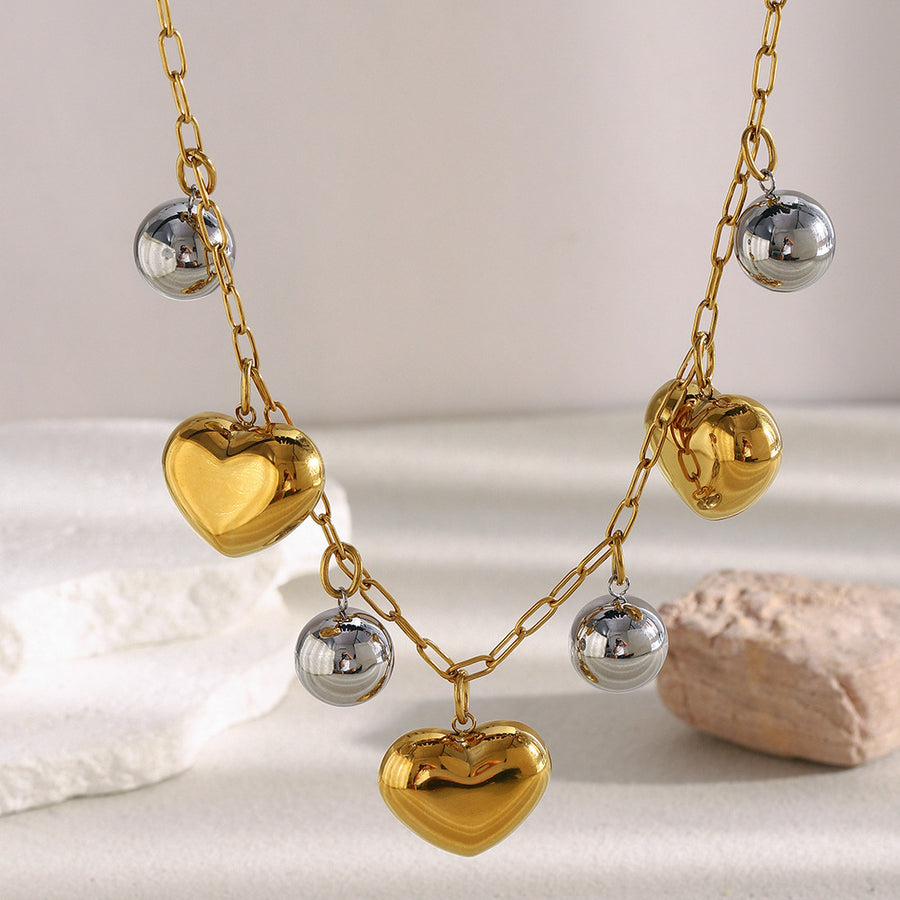 two-tone puffy heart and silver-finish bead charm necklace