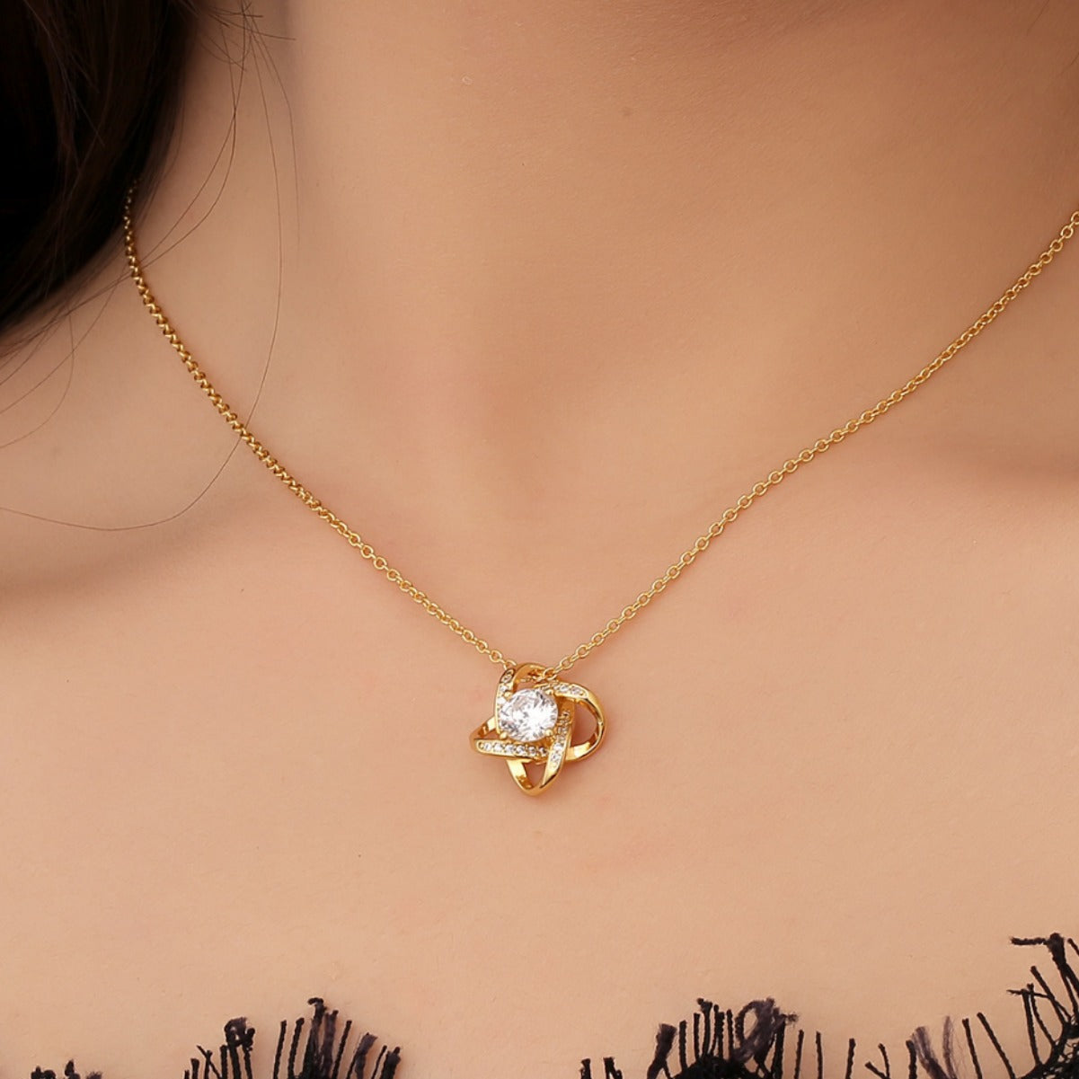 gold plated orbit clear stone necklace worn at the collarbone