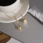 pair of gold plated calla lily freshwater pearl earrings
