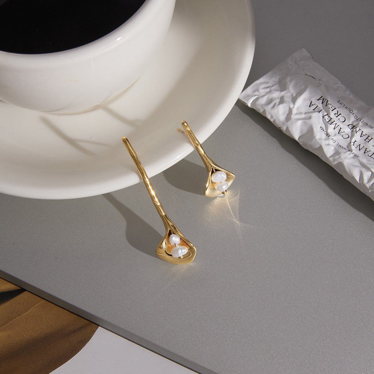 pair of gold plated calla lily freshwater pearl earrings