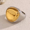 two-tone stainless steel signet ring with a gold plated pebble dome