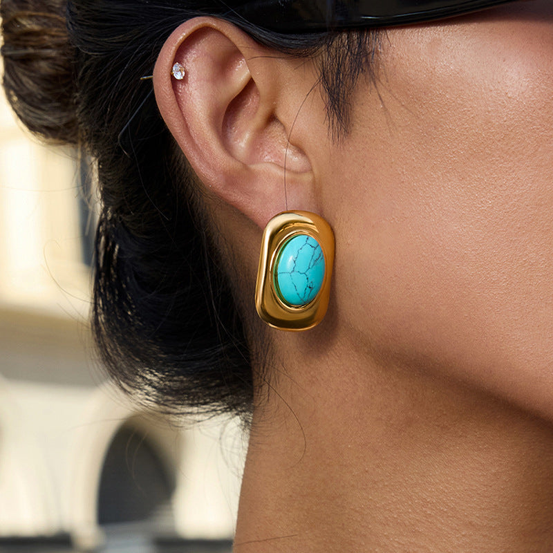 Gold-Tone Turquoise-Color Cabochon Stainless Steel Stud Earrings shown on model