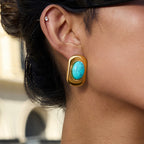 Gold-Tone Turquoise-Color Cabochon Stainless Steel Stud Earrings shown on model