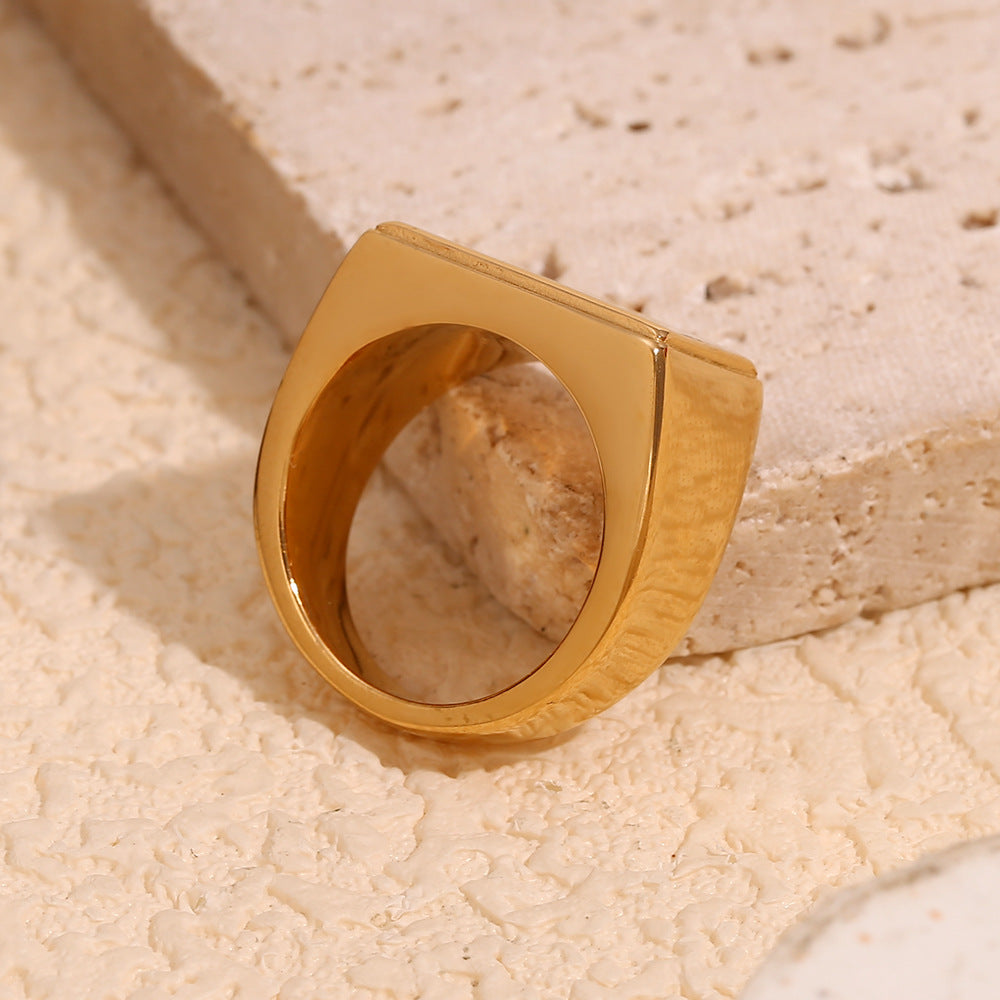 underside view of broad gold plated message signet ring