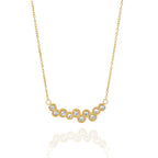 Fine chain necklace with curved stone arrangement on white