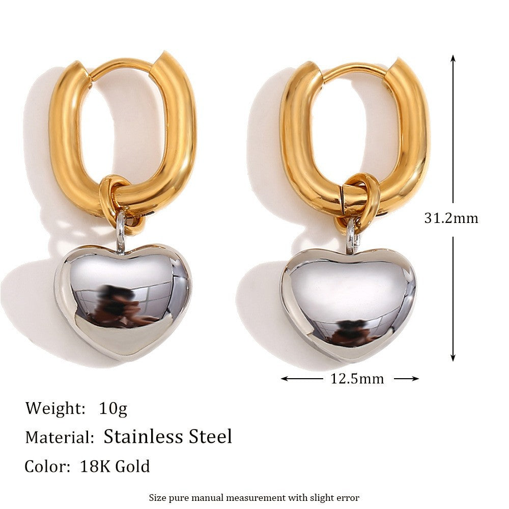 Silver tone heart charms on gold tone hoops with measurements