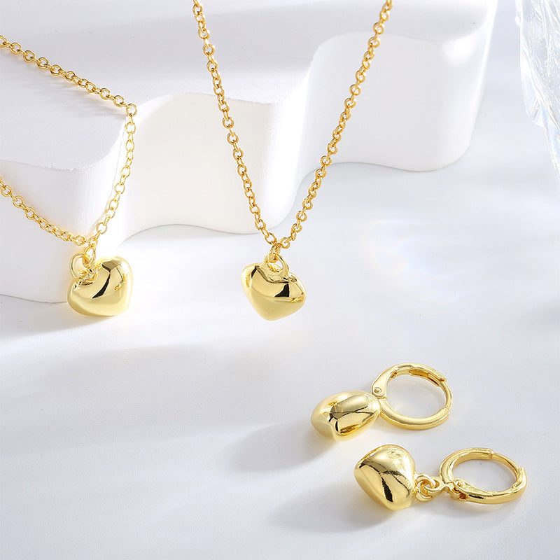 matching puffed heart pendant necklace bracelet and hoop earrings