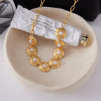 Gold-Tone Pearl-Look Stainless Steel Necklace and Bracelet Collection close-up product view