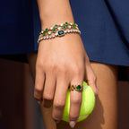 Green-accent bracelets and ring in styled wear