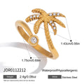 Open palm tree ring with round clear accent