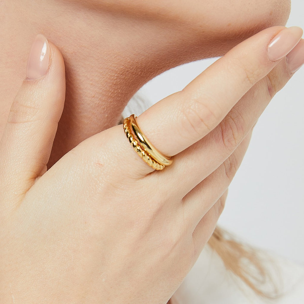 braided double-band gold plated open ring worn on the finger