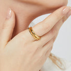 braided double-band gold plated open ring worn on the finger