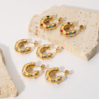 Clear multicolor and pearl-look hoops on stone display blocks