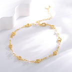 open-heart white bead anklet arranged on a white display