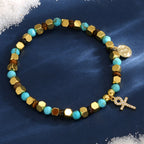 mixed-color cross bead bracelet on a blue display