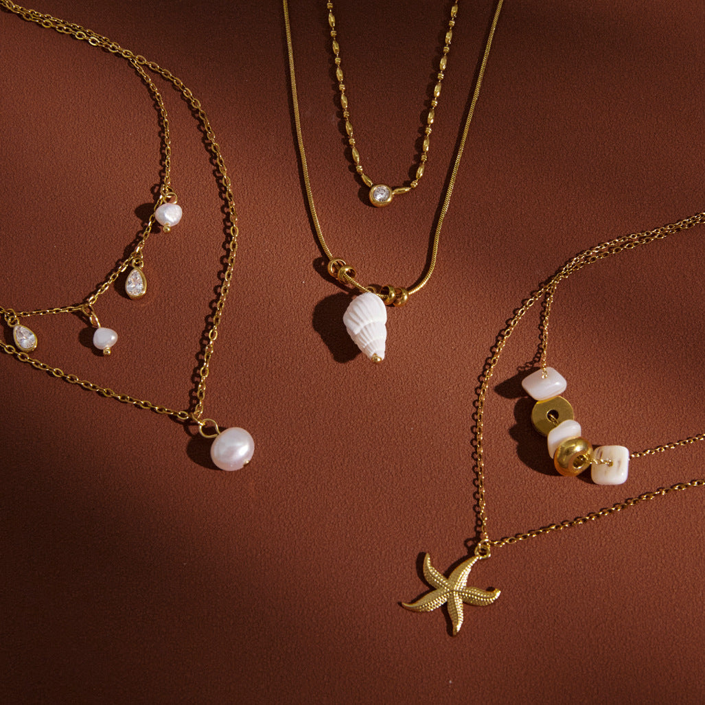 Three double-layer coastal necklace designs displayed together