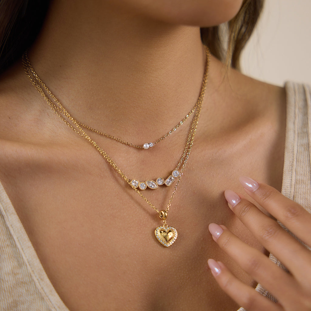Mixed-shape cluster necklace shown in a layered look