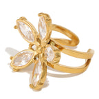 isolated gold plated floral open ring with marquise clear stones