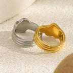 back view of gold plated and silver-finish ridged heart rings