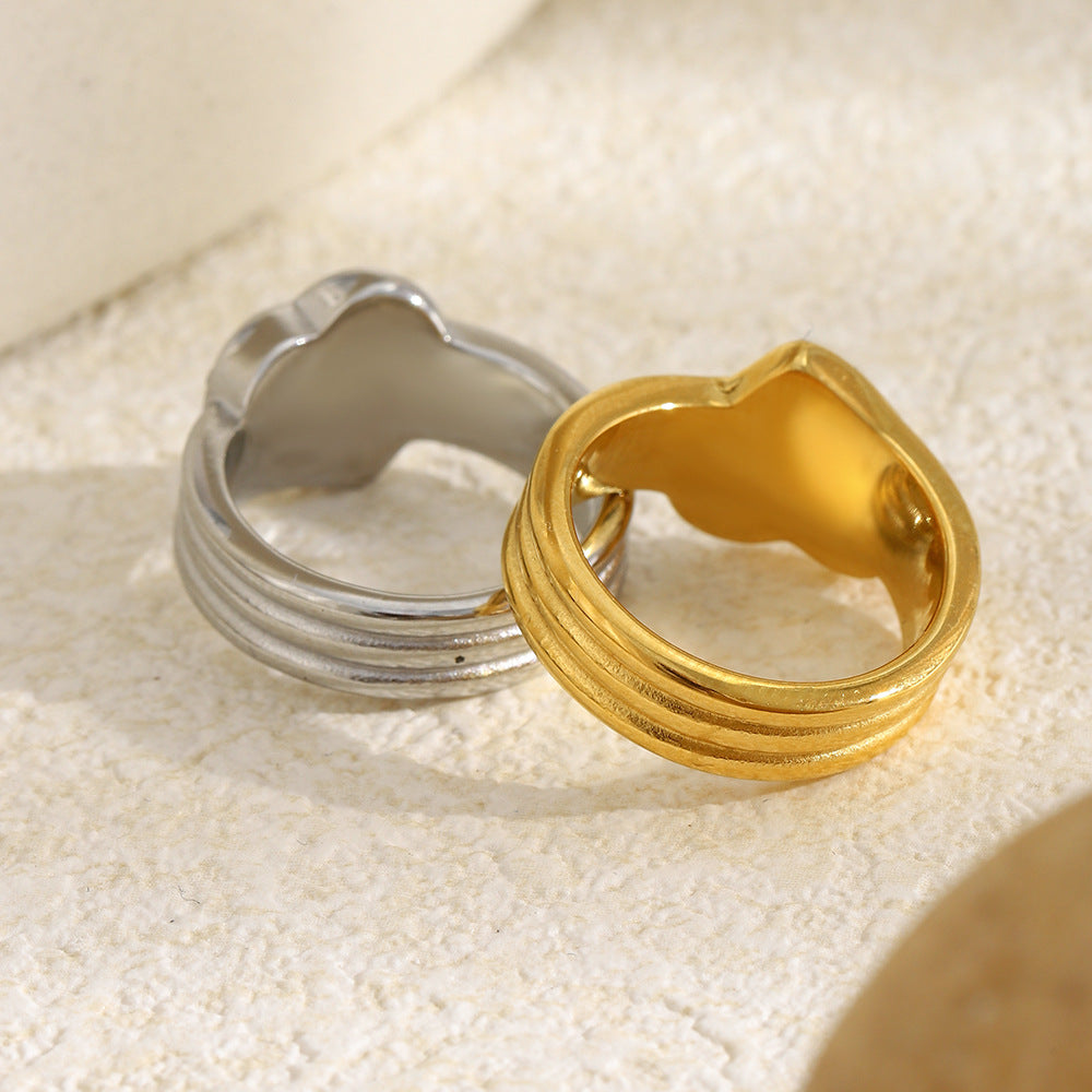 back view of gold plated and silver-finish ridged heart rings