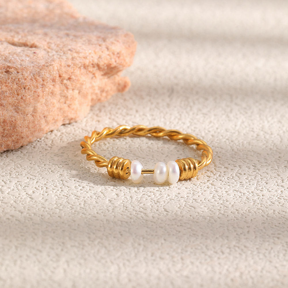 Gold plated twisted ring with three white pearls
