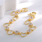 gold plated heart link bracelet arranged in a soft curve