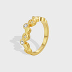 gold plated brass band ring with zirconia and starburst discs