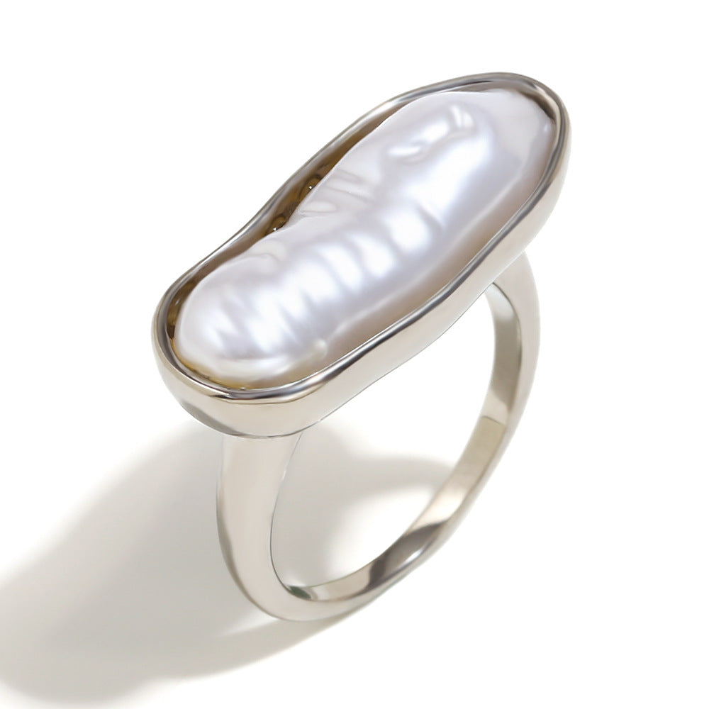 isolated silver-finish stainless steel ring with elongated white pearl