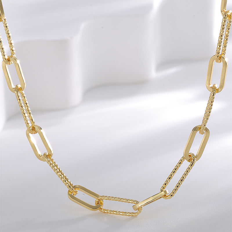 close front view of polished rectangular links and textured chain segments
