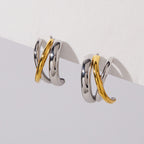 Gold diagonal line crossing silver tone curved bands