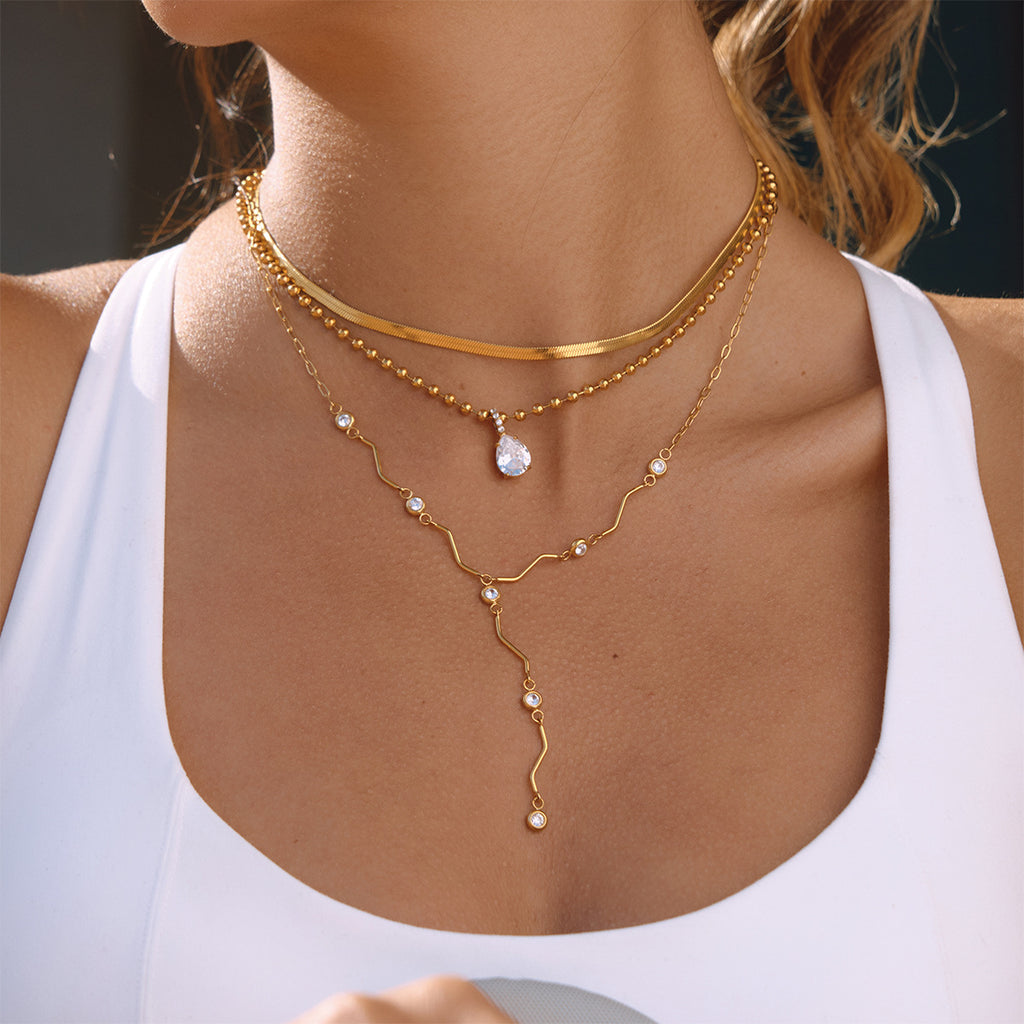 Gold-Tone Clear Stone Stainless Steel Y Necklace Collection — continuous stone row design
