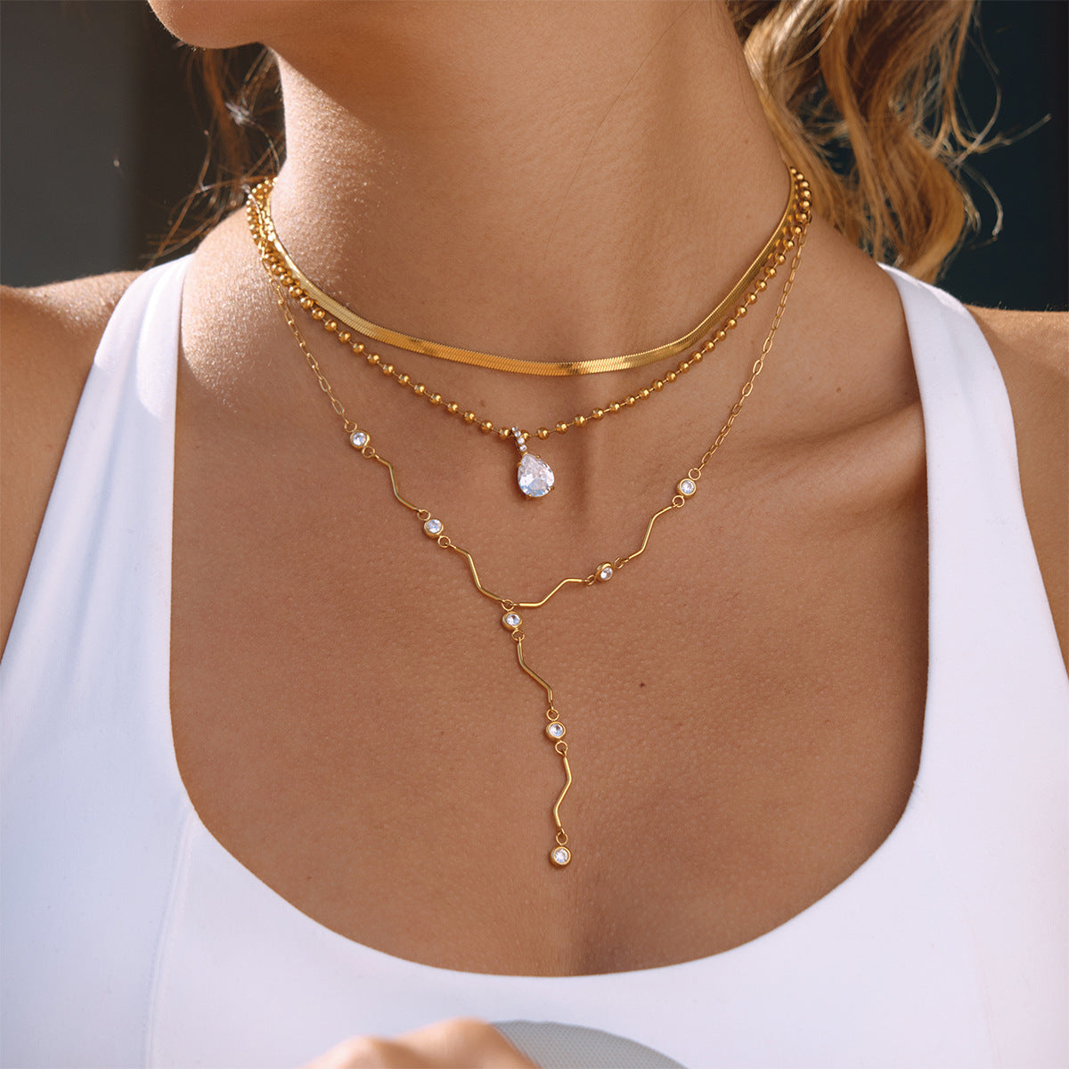 Gold-Tone Clear Stone Stainless Steel Y Necklace Collection — continuous stone row design