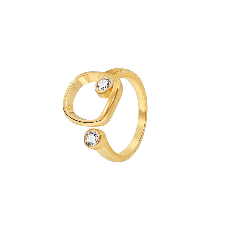 isolated gold plated square frame stone ring on white