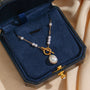 gold plated toggle necklace with irregular white pearl-style bead drop