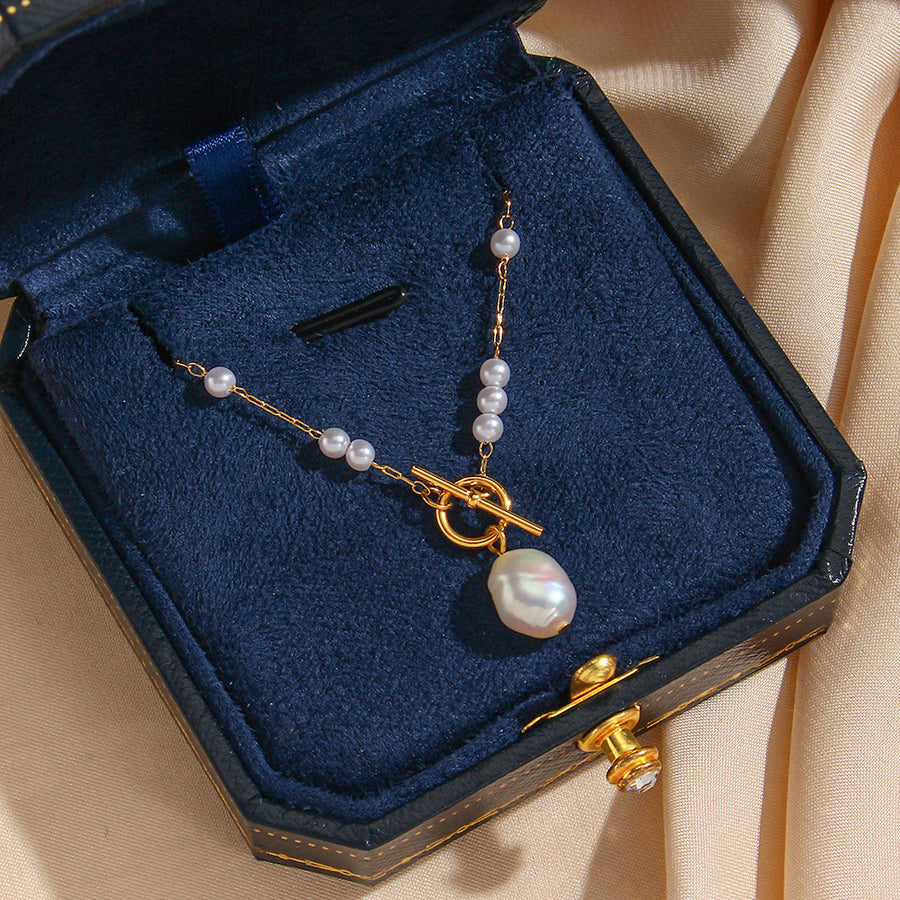gold plated toggle necklace with irregular white pearl-style bead drop