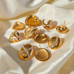 Gold Plated Clear Accent Stainless Steel Stud Earring Collection — front view