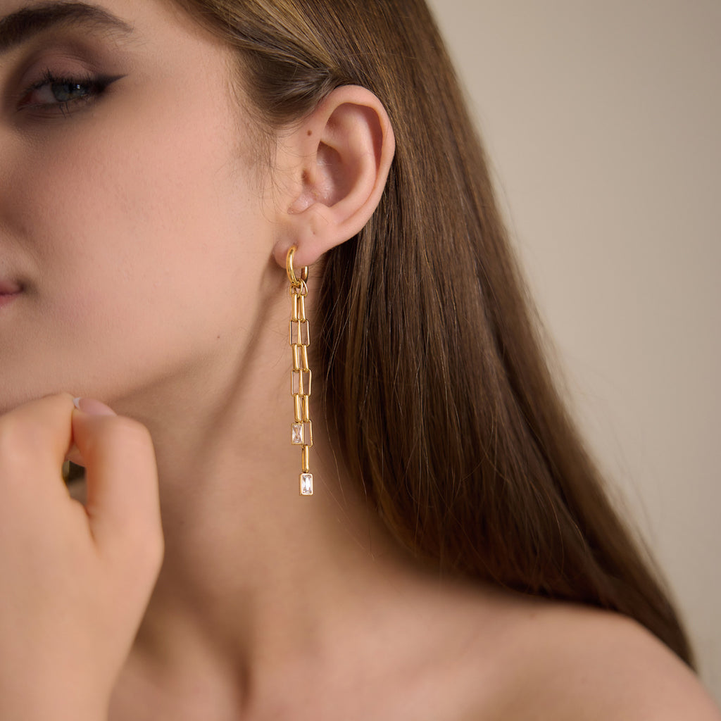 Rectangular-link tassel earring shown on a model